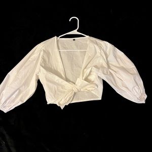 White puff sleeved crop top that ties in front. never worn